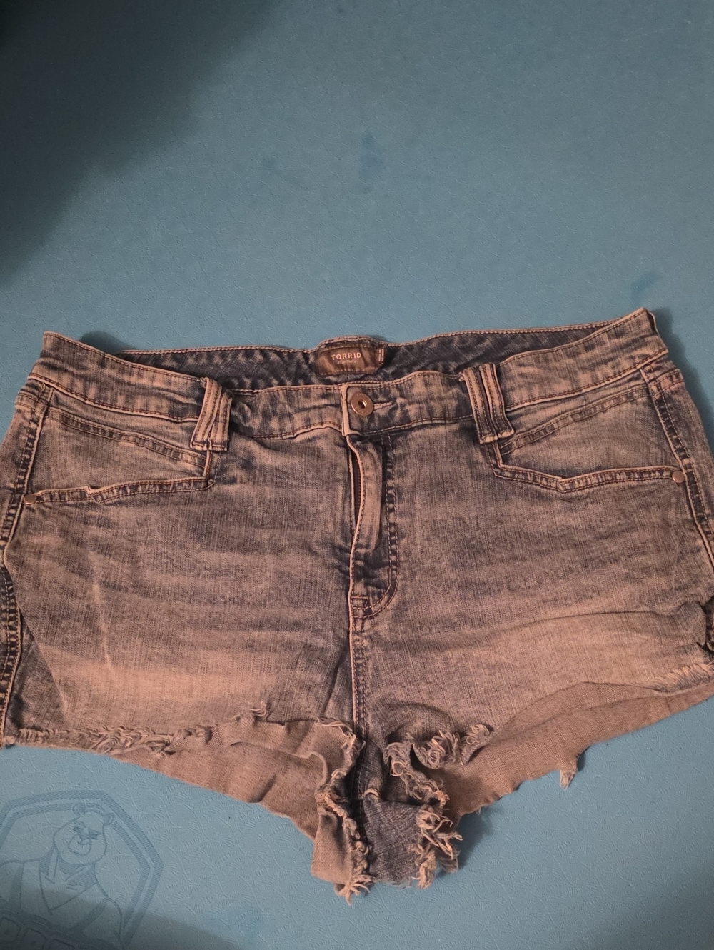 torrid faded blue denim cutoff shorts